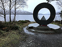 Rowerdennan to Loch Arklet. The monument, by Scottish artist Doug Cocker, acts as a focal point for the Ben Lomond National Memorial Park.  This was established to commemorate those Scots who laid down their lives during the Second World War.